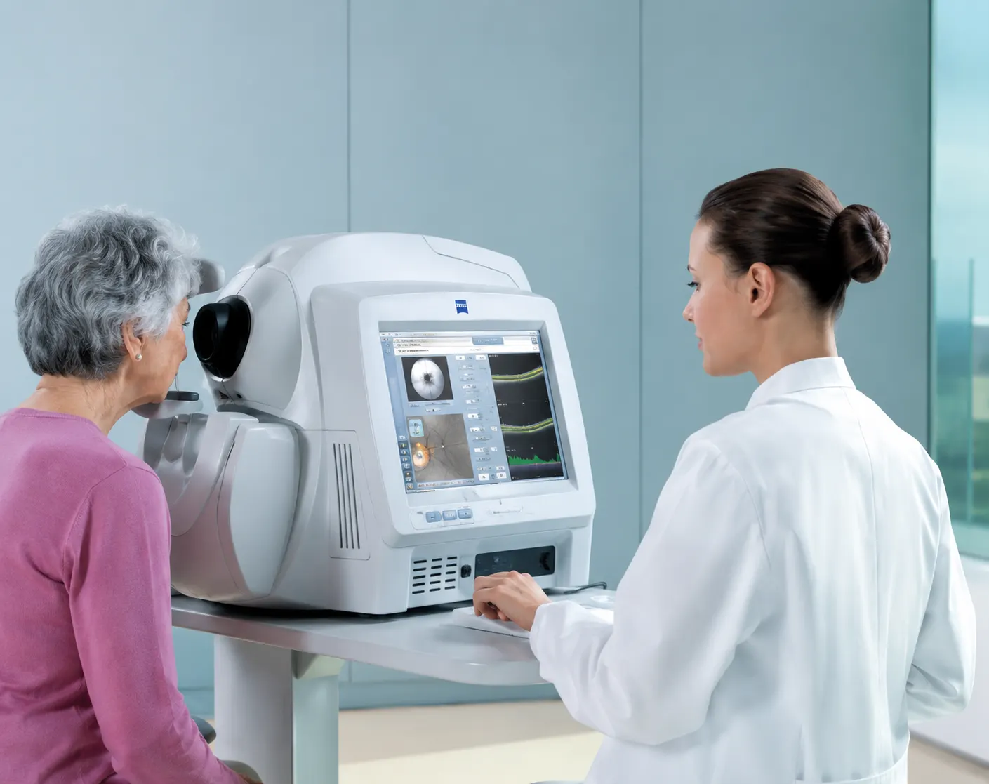 An optometrist uses a Zeiss HD OCT to scan a woman's retinas.