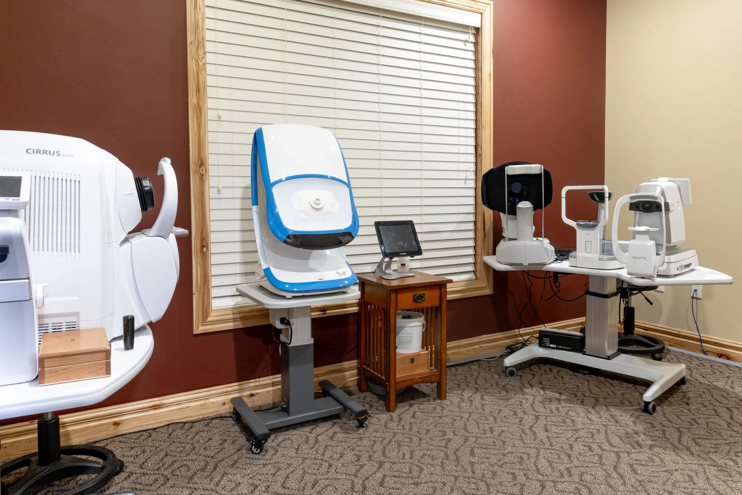 Eye exam room with diagnostic equipment at The Eyecare Center