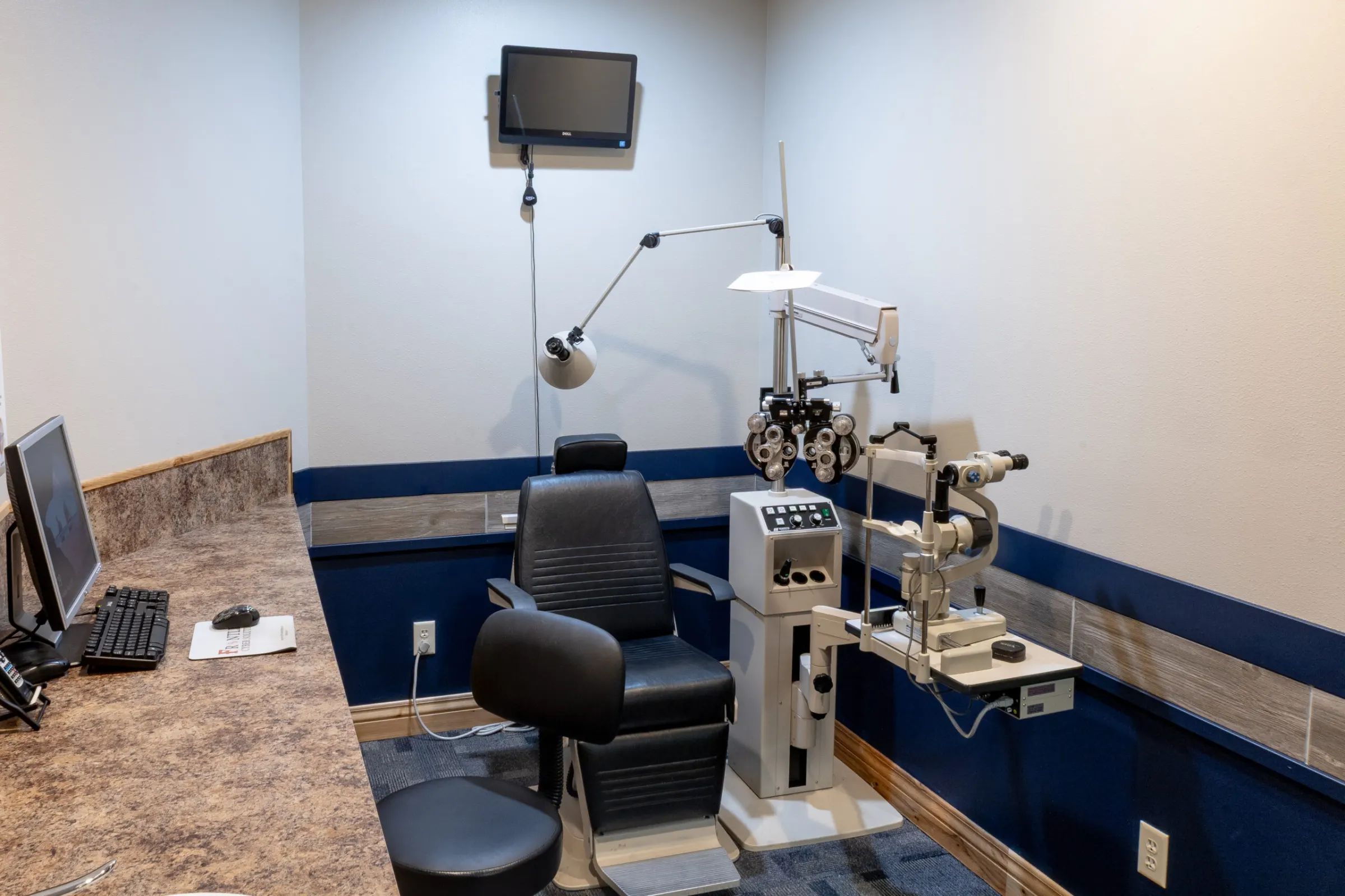 Eye exam room with diagnostic equipment at The Eyecare Center